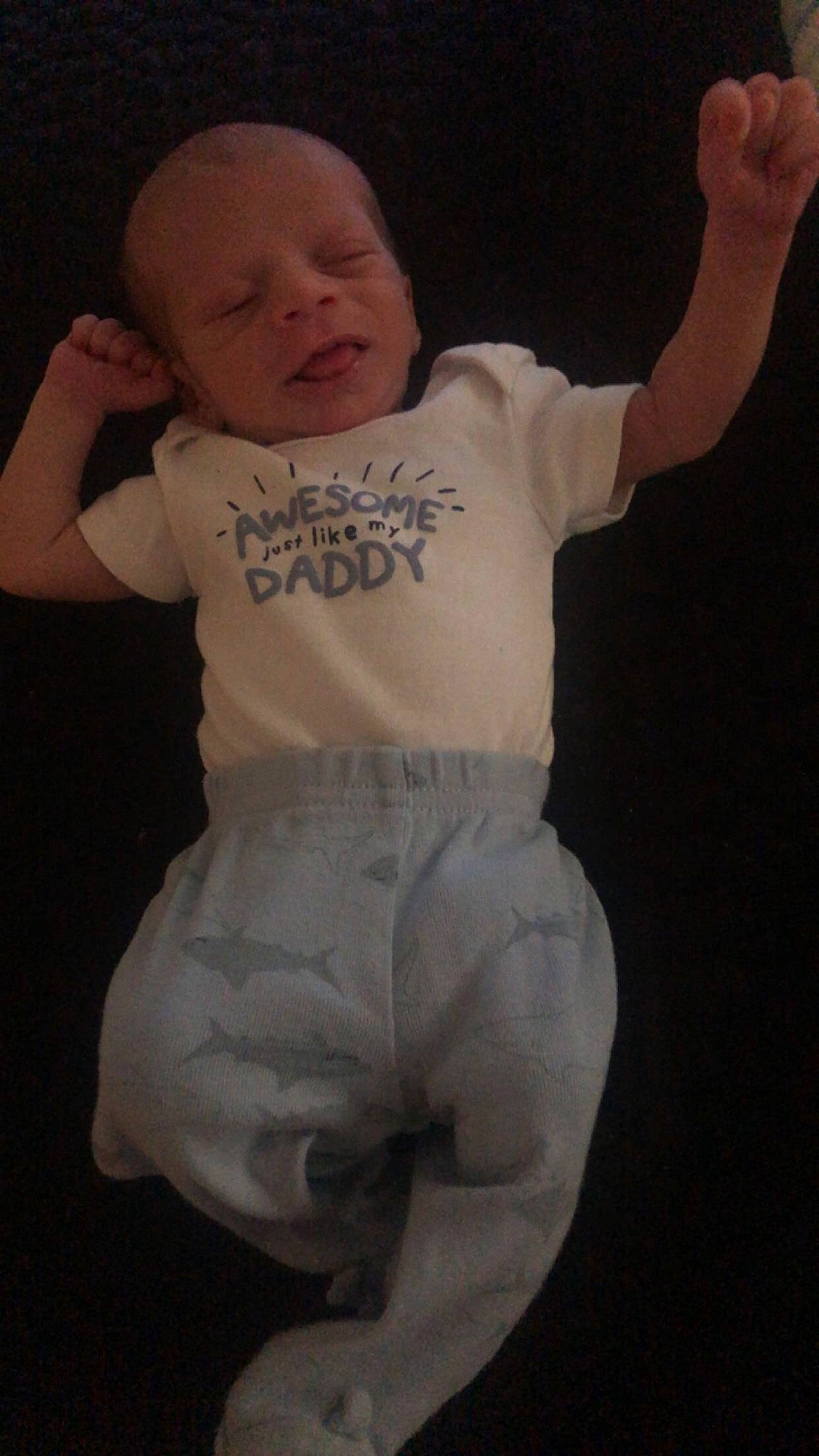 Ezrah is registered to the contest to win money with this photo: baby, baby_toddler_clothing, cheek, chin, comfort, eye, face, facial_expression, finger, flash_photography, gesture, hairstyle, head, leg, mouth, neck, nose, person, skin, sleeve