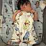 Laquell is registered to the contest to win money with this photo: baby, newborn, sleeping, infant, blanket, clothing, onesie, winnie_the_pooh, tiger, piglet, eeyore, footwear, sock, crib, soft_toys, cute, resting, indoors, child, peaceful