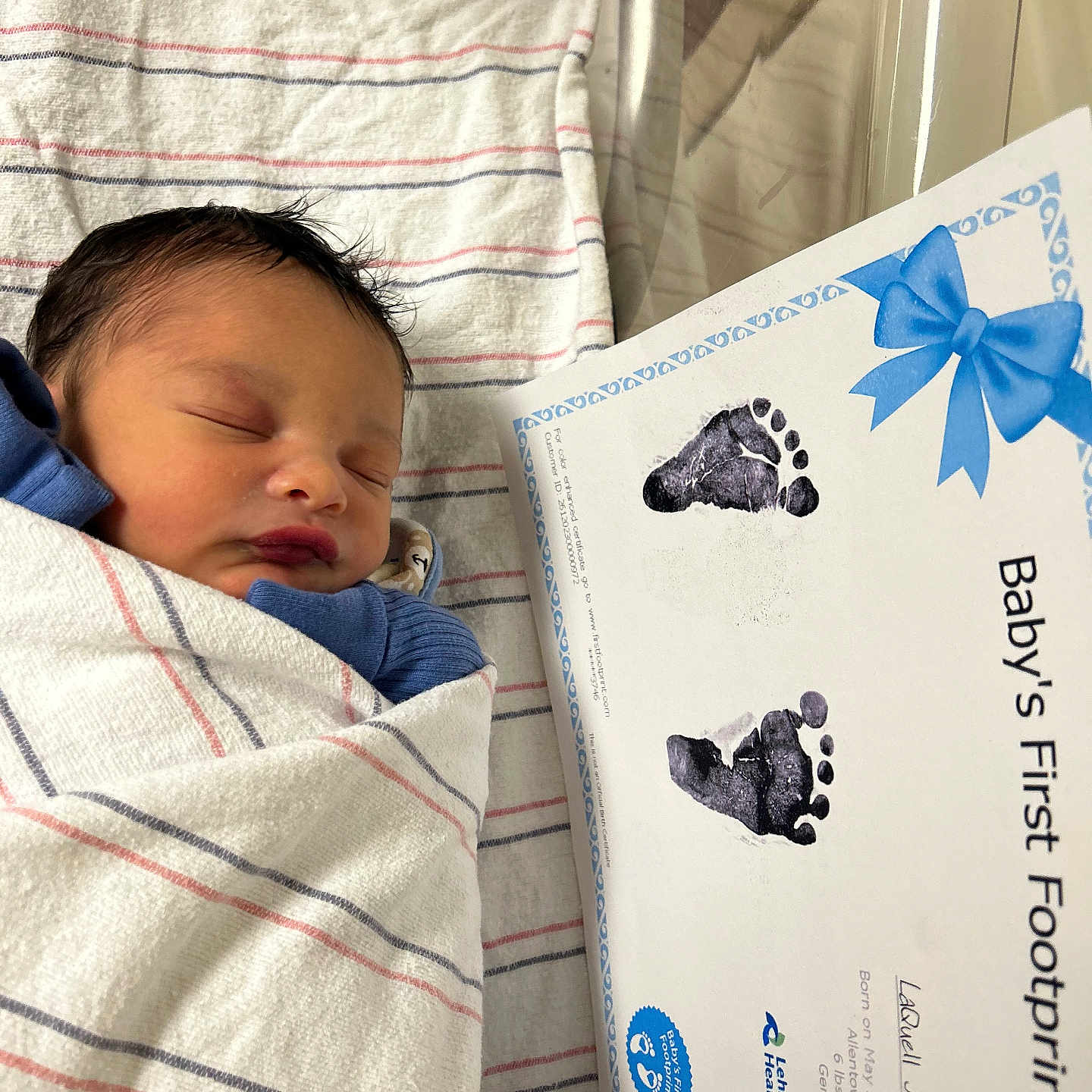 Laquell is registered to the contest to win money with this photo: newborn, baby, sleeping, blanket, hospital, footprints, certificate, birth, infant, wrapped, peaceful, portrait, child, healthcare, bed, clothing, person, cute, resting, soft