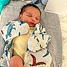 Laquell joined the competition — help win amazing prizes! baby, newborn, sleeping, blanket, dinosaur_pattern, plush_toy, teddy_bear, baby_bottle_manual, soft_surface, yellow_clothing, infant, cute, child, indoors, cozy, resting, peaceful, face, person, young_child