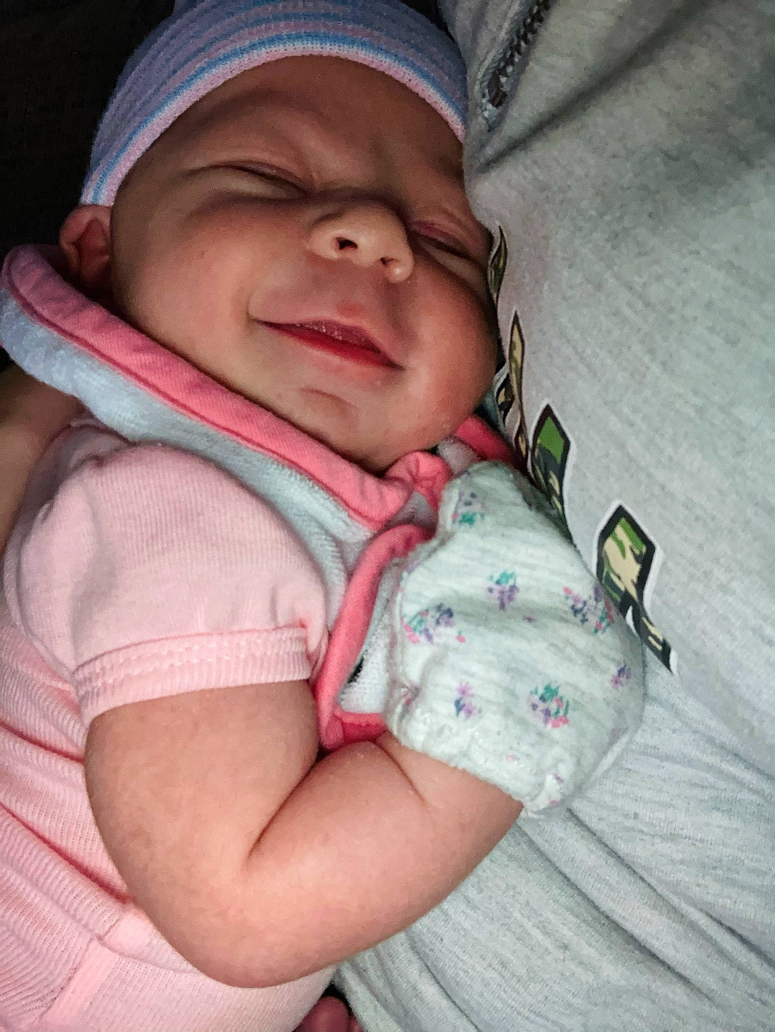 Harper is registered to the contest to win money with this photo: baby, baby_carriage, baby_products, baby_safety, baby_sleeping, baby_toddler_clothing, cap, cheek, child, comfort, finger, happy, headwear, linens, nose, person, sitting, skin, sleeve, smile