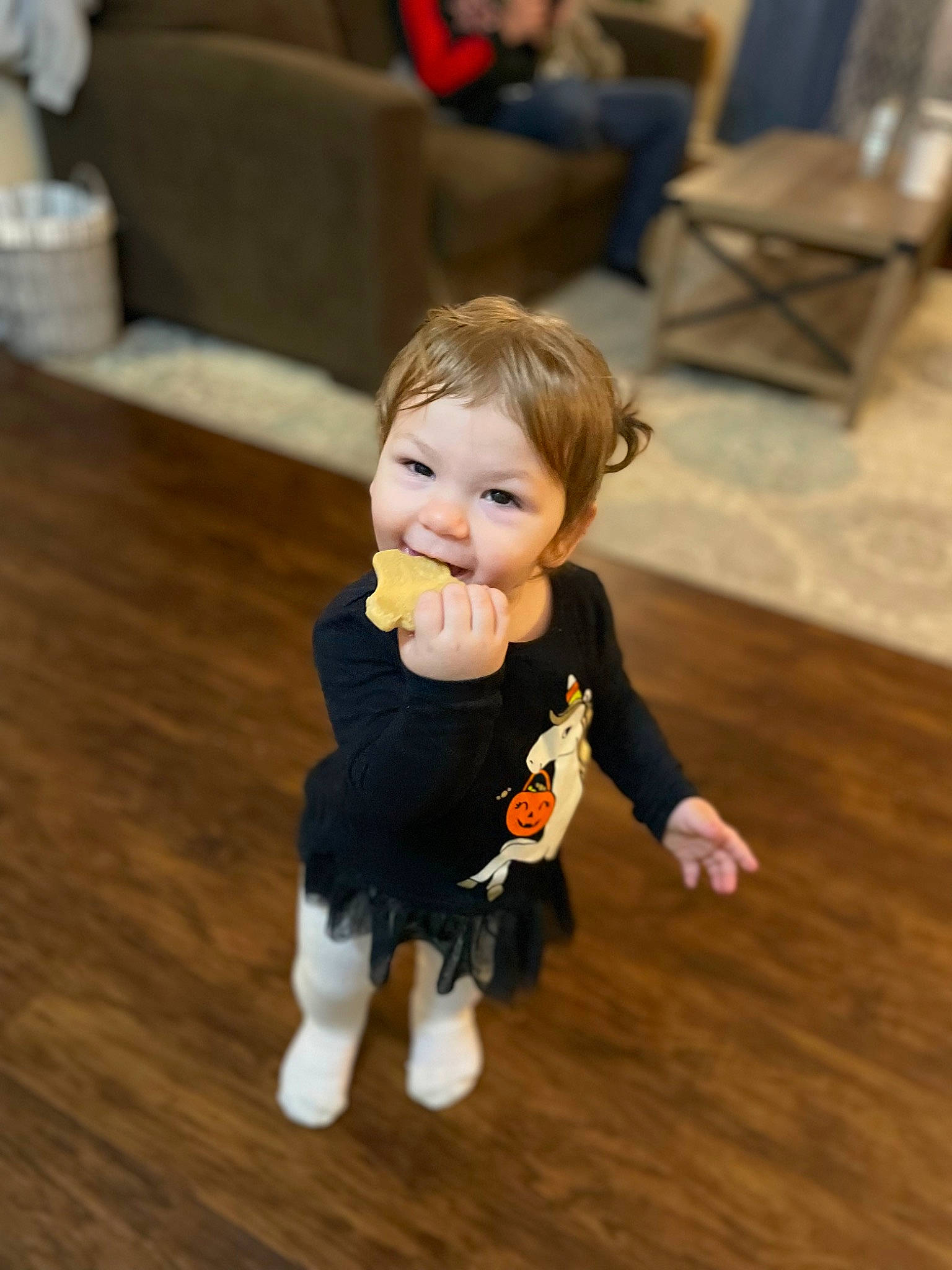 Harper is registered to the contest to win money with this photo: baby_toddler_clothing, cheek, child, event, floor, flooring, fun, happy, hardwood, human_body, laminate_flooring, person, skin, smile, standing, toddler, toy, varnish, wood, wood_flooring