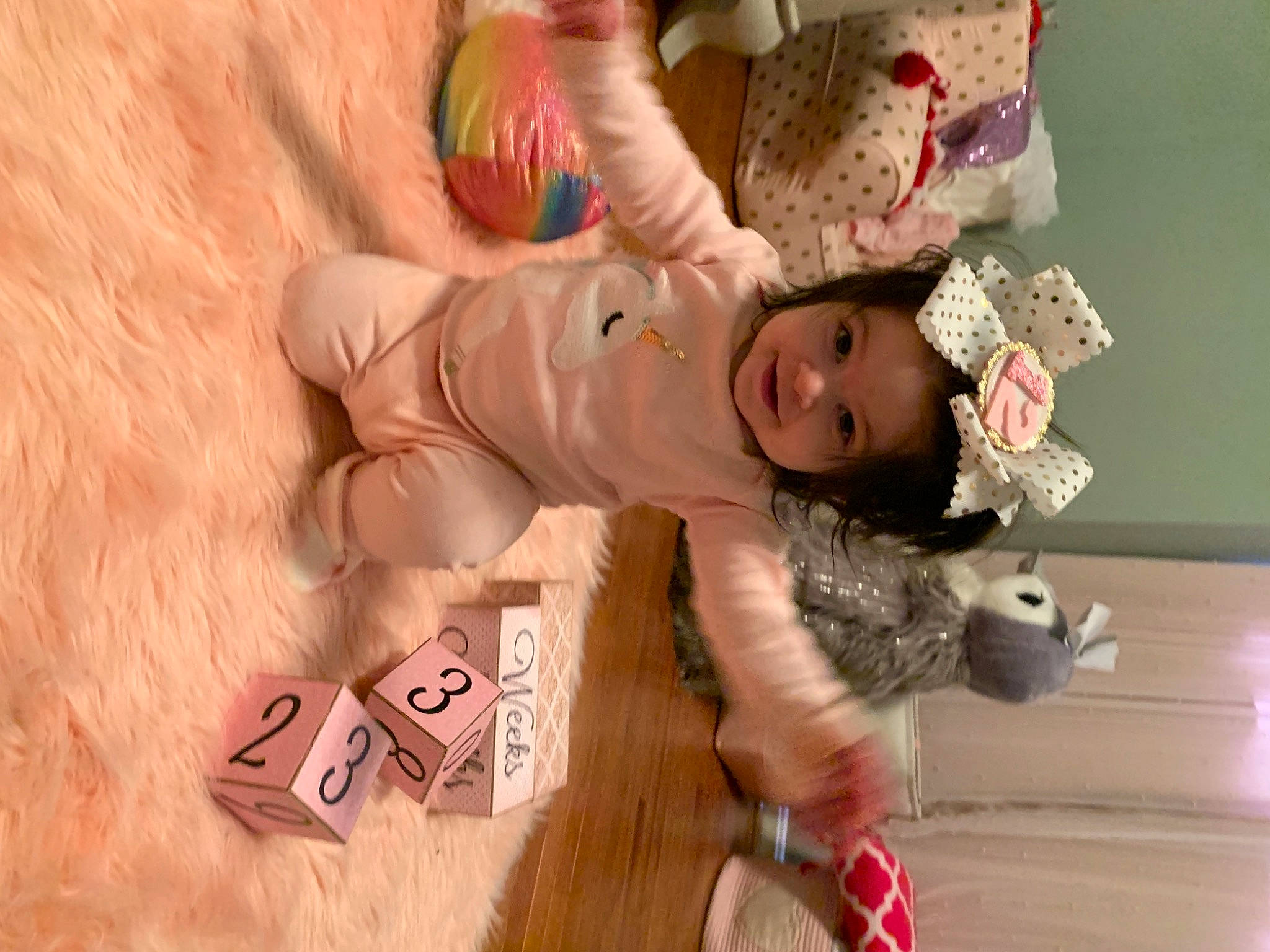 Milania is registered to the contest to win money with this photo: baby, baby_products, baby_toddler_clothing, baby_toys, cheek, child, headwear, human, mammal, nose, number, peach, person, pink, play, playing_with_kids, sand, stuffed_toy, toddler, toy