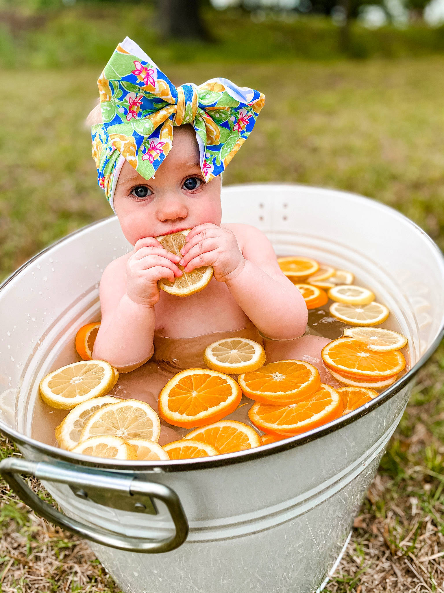 Madisyn is registered to the contest to win money with this photo: baby, baby_products, bathing, cap, child, costume_hat, crown, cuisine, event, fashion_accessory, fictional_character, grass, happy, headband, headpiece, headwear, party_supply, person, personal_protective_equipment, plant