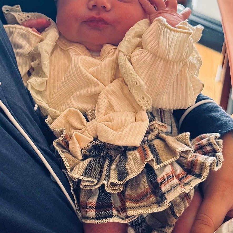 Tiger-Lily is registered to the contest to win money with this photo: arm, baby, bottle, closeup, clothing, cozy, cute, foot, hand, headband, indoor, infant, lace, newborn, person, plaid, rest, sleeping, soft_lighting, window