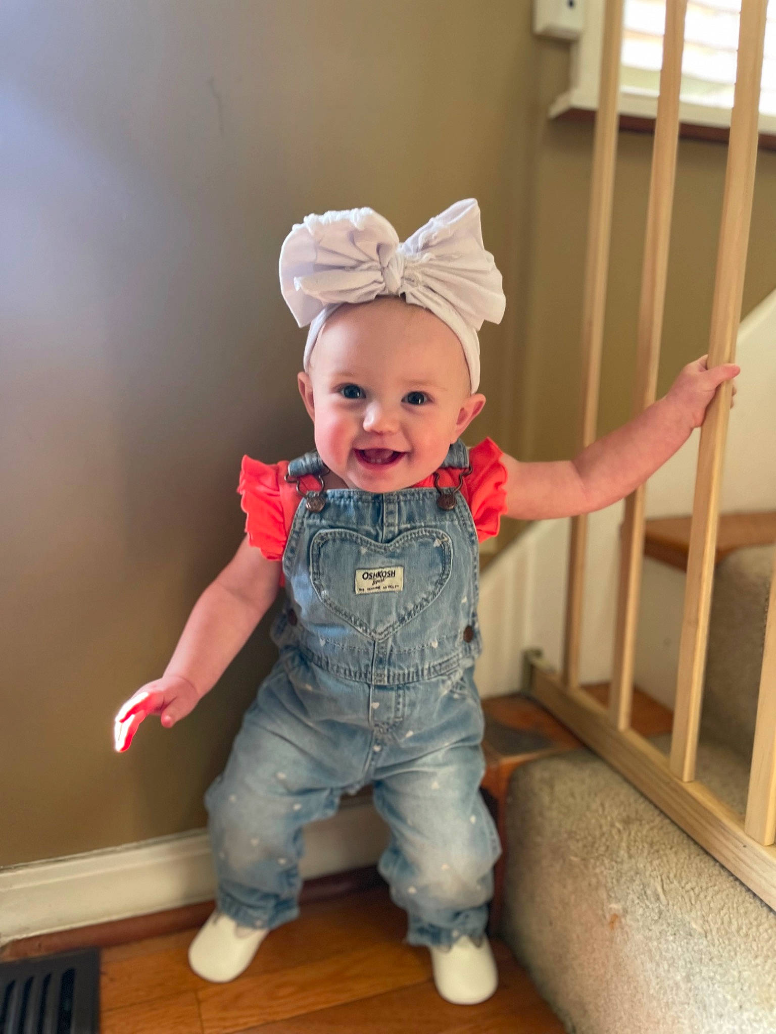Adelynn is registered to the contest to win money with this photo: baby, baby_toddler_clothing, child, floor, flooring, happy, hardwood, hat, pattern, person, room, sitting, skin, sleeve, smile, sock, t_shirt, toddler, wood, wood_flooring