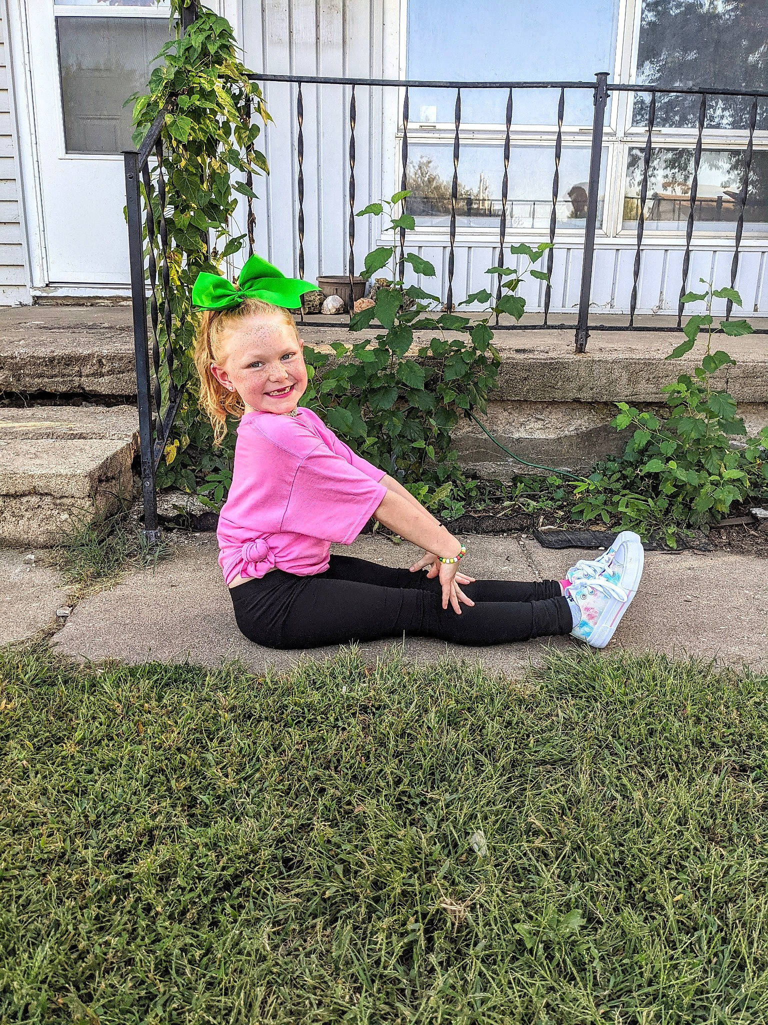 Zayleigh joined the competition — help win amazing prizes! fence, garden, grass, hair, happy, hat, human_leg, joy, knee, lawn, leisure, mammal, people_in_nature, person, plant, public_space, recreation, shrub, sitting, t_shirt