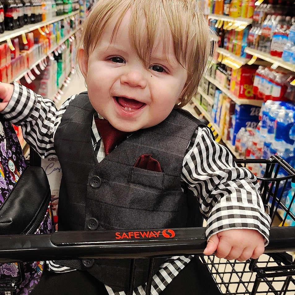 Sawyer is registered to the contest to win money with this photo: accessories, bag, boy, child, clothing, face, food, footwear, handbag, head, indoors, male, pants, person, photography, portrait, shelf, shoe, shop, shopping