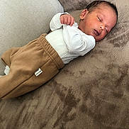 Isaac participe au concours pour gagner de l'argent avec cette photo : baby, newborn, sleeping, infant, blanket, clothing, cushion, face, person, rest, comfort, soft, indoors, peaceful, portrait, child, cute, sleep, relaxation, warm