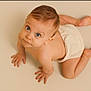 Alessio participe au concours pour gagner de l'argent avec cette photo : child, baby, infant, diaper, crawling, looking_up, blue_eyes, skin, bare_skin, studio, neutral_background, floor, adorable, portrait, face, hands, feet, hair, expression, wide_eyes