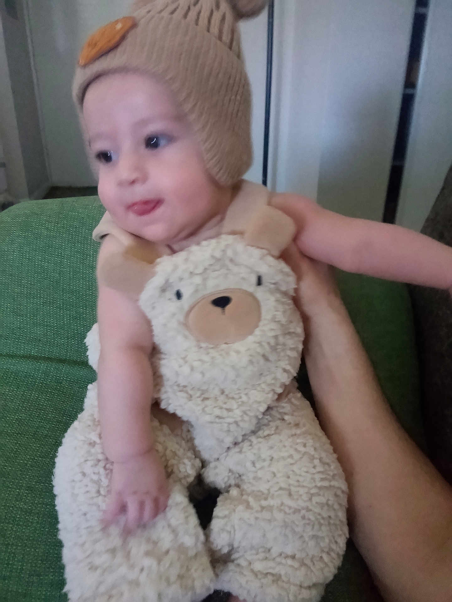 Joshua joined the competition — help win amazing prizes! baby, beanie, bodypart, bonnet, cap, clothing, costume, couch, cushion, face, finger, furniture, hat, head, homedecor, person, photography, portrait, teddybear, toy