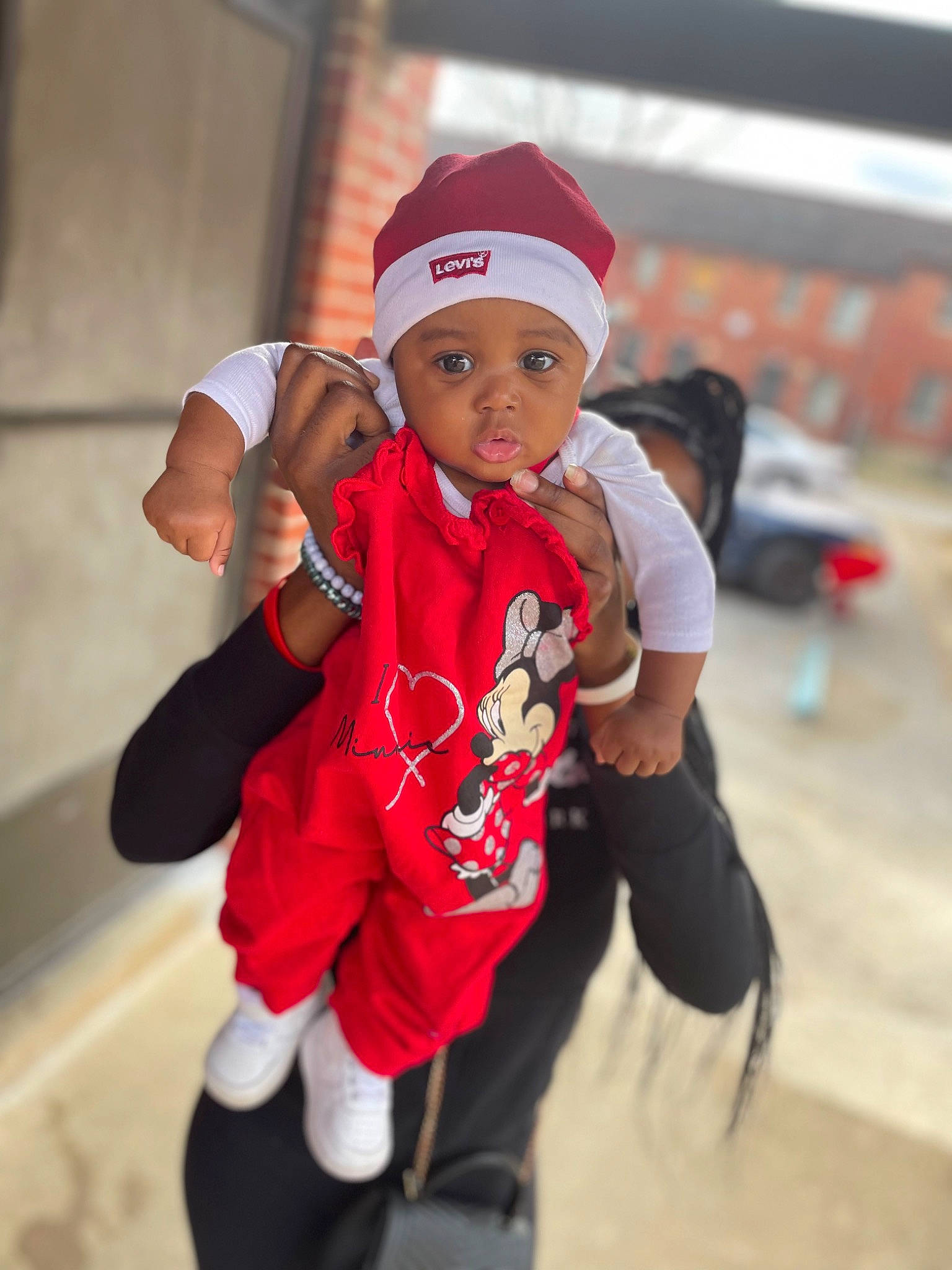 Khalani joined the competition — help win amazing prizes! baby, baseball_cap, cap, child, costume, event, fun, glove, happy, hat, headwear, jacket, leisure, person, personal_protective_equipment, play, recreation, sleeve, t_shirt, toddler