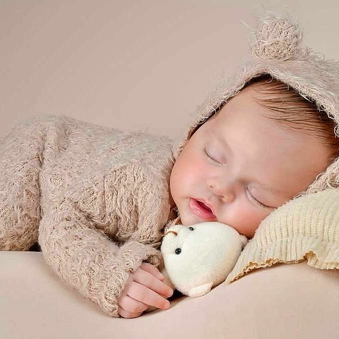 Neil Rafael is registered to the contest to win money with this photo: adorable, baby, bear_ears, blanket, child, clothing, costume, cozy, cute, face, hand, indoors, infant, newborn, peaceful, plush_toy, portrait, resting, sleeping, soft_texture