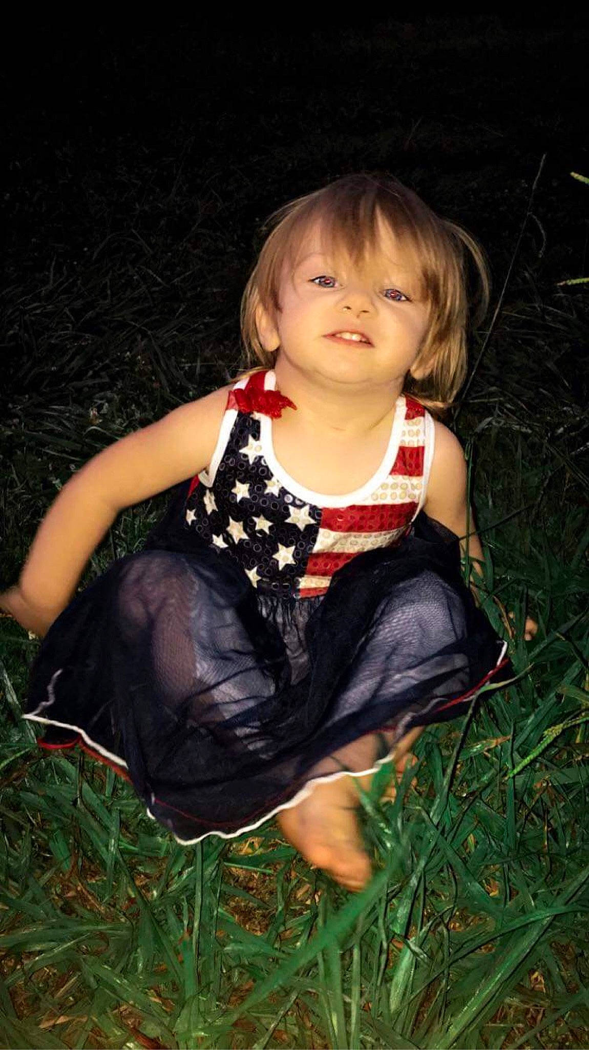 Ravena is registered to the contest to win money with this photo: baby_toddler_clothing, blond, brown_hair, child, dress, flash_photography, foot, fun, grass, happy, human_leg, iris, leg, pattern, people_in_nature, person, sitting, skin, toddler, tree