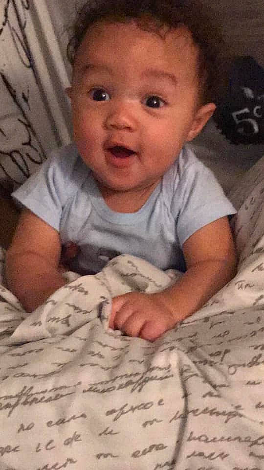 Kb Jr is registered to the contest to win money with this photo: baby, cheek, child, chin, eye, face, facial_expression, finger, forehead, hand, head, lip, mouth, nose, person, skin, smile, surprise, toddler, tummy_time