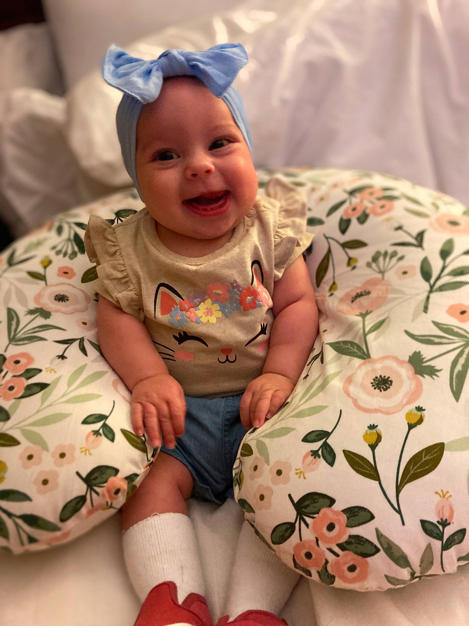 Sophia joined the competition — help win amazing prizes! baby, baby_toddler_clothing, child, comfort, event, eye, finger, happy, headwear, human_body, human_leg, lap, leg, person, pink, skin, sleeve, smile, sock, thigh