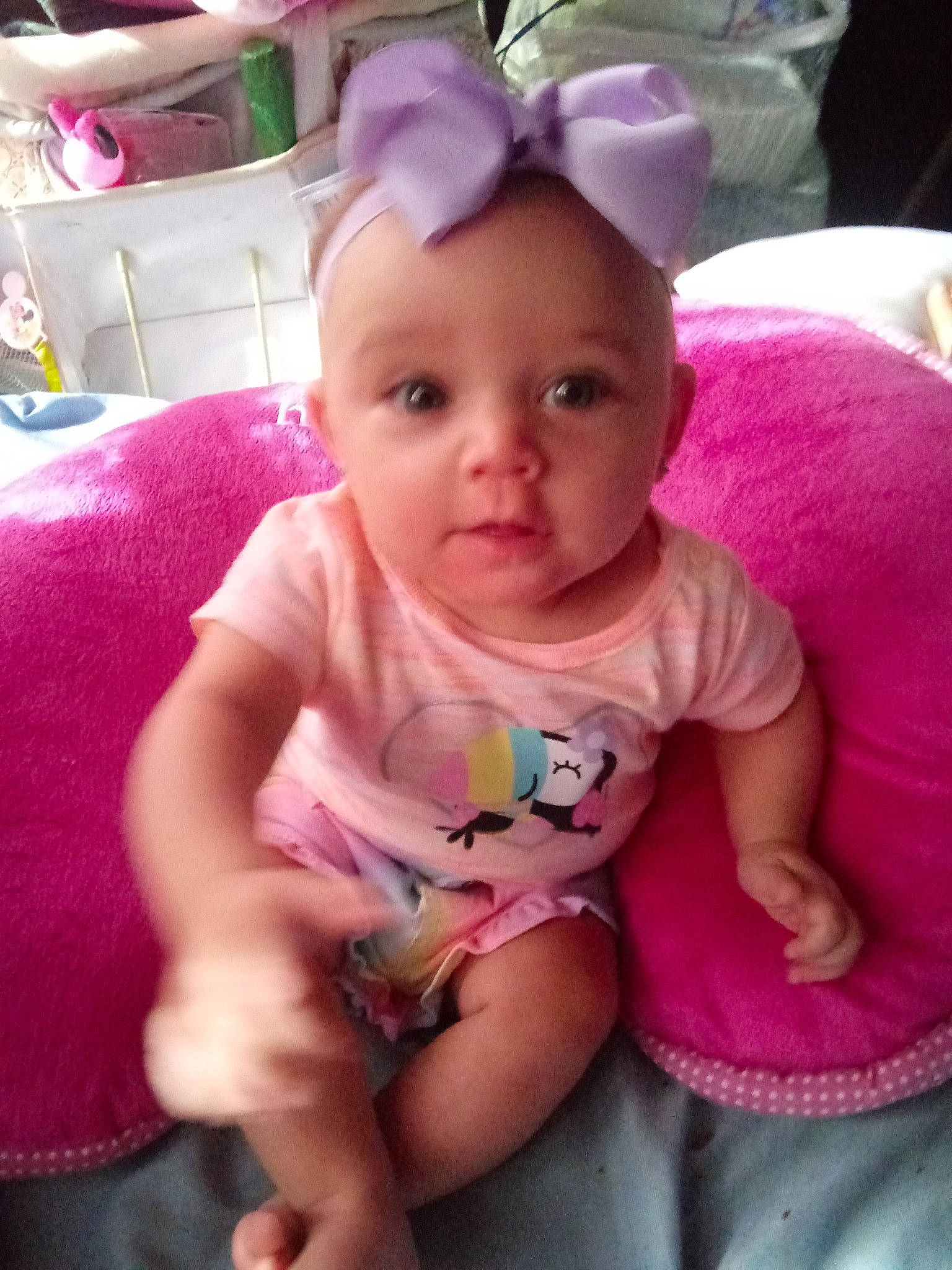 Ravyn is registered to the contest to win money with this photo: baby, baby_products, baby_toddler_clothing, cheek, child, eye, face, fun, head, lip, mouth, person, pink, play, product, sitting, skin, smile, toddler