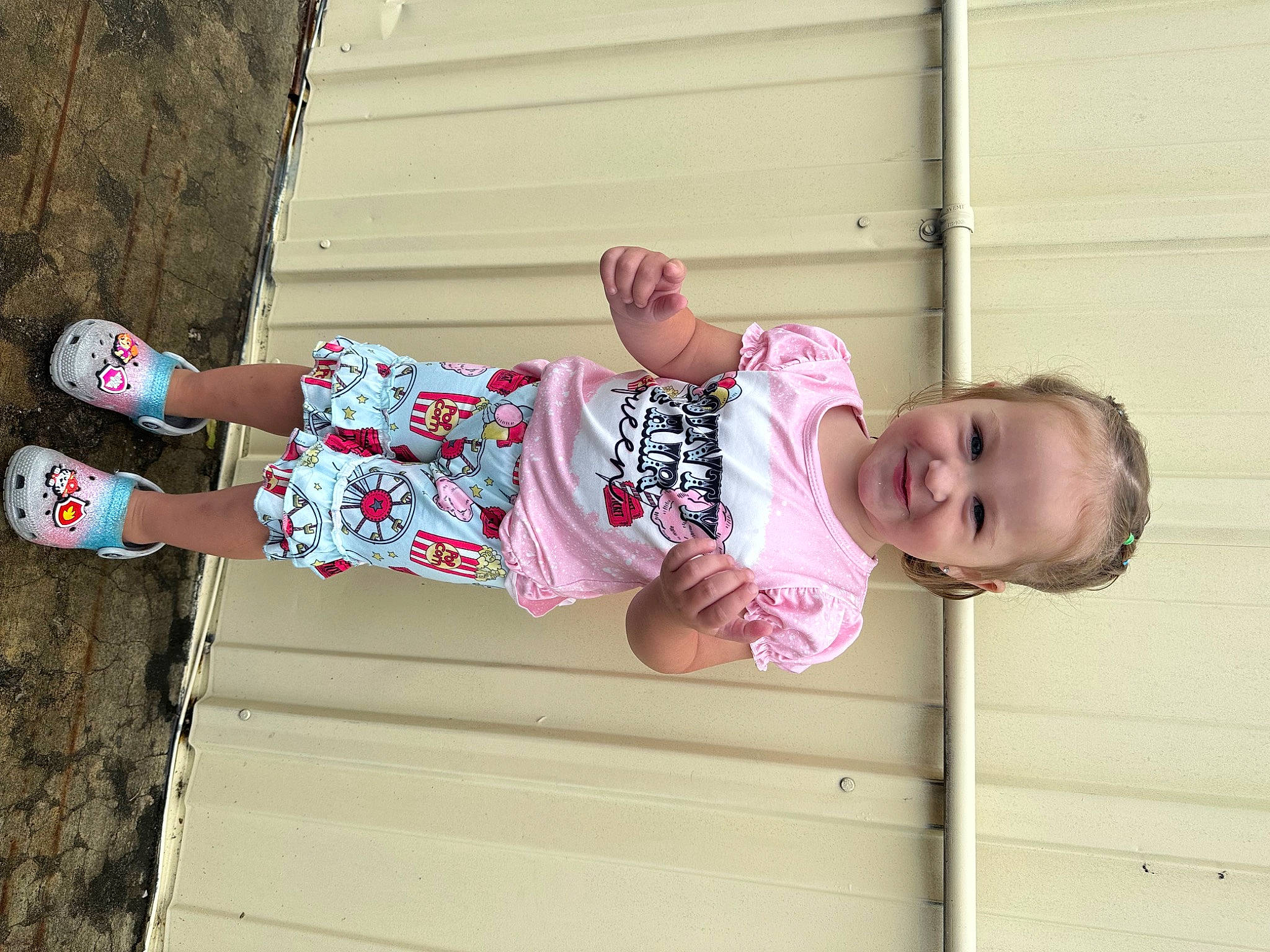 Sophie is registered to the contest to win money with this photo: art, baby_toddler_clothing, child, face, fun, happy, human_leg, joy, leisure, magenta, outdoor_shoe, pattern, person, pink, sleeve, smile, t_shirt, thigh, toddler, visual_arts
