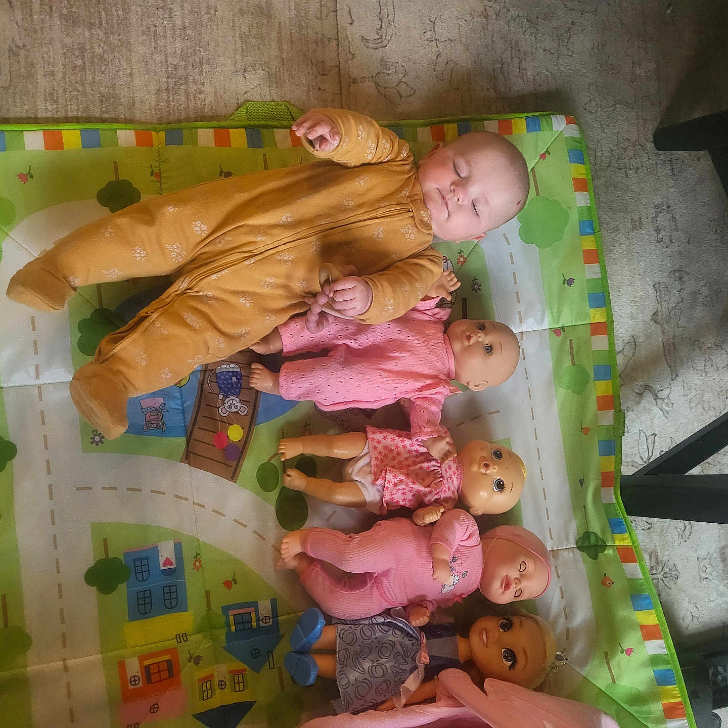 Piper is registered to the contest to win money with this photo: baby, carpet, child, collection, cute, doll, floor, footwear, furniture_leg, indoor, infant, mustard, onesie, pink, play_mat, pose, purple, relaxing, sleeping, toy