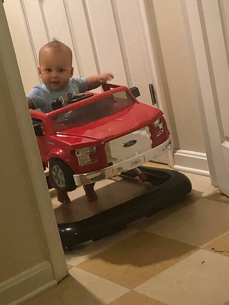 Cason is registered to the contest to win money with this photo: car, child, city_car, floor, flooring, person, room, toddler, toy, vehicle