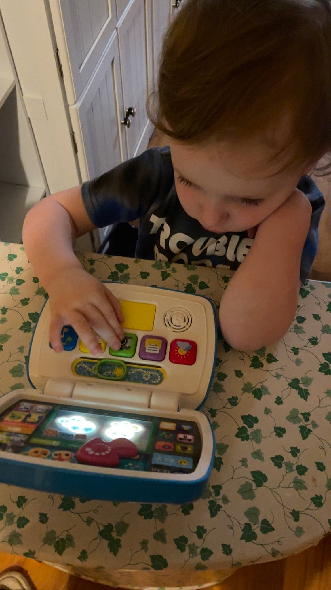 Xzander is registered to the contest to win money with this photo: baby, cabinetry, child, curious, electronic_device, electronics, finger, flooring, fun, gadget, input_device, learning, nail, office_equipment, person, play, room, sharing, t_shirt, toddler