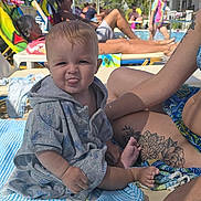 Jake joined the competition — help win amazing prizes! baby, child, poolside, sunny, towel, lounge_chair, tattoo, woman, hand, ring, sunglasses, umbrella, swimwear, outdoor, people, water, relaxation, summer, tongue_out, playful