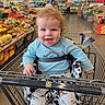 Ronin joined the competition — help win amazing prizes! baby, child, infant, smiling, happy, portrait, grocery_store, shopping_cart, produce, fruit, vegetables, supermarket, indoor, blue_shirt, patterned_clothing, seated, curly_hair, food, retail, family_outing