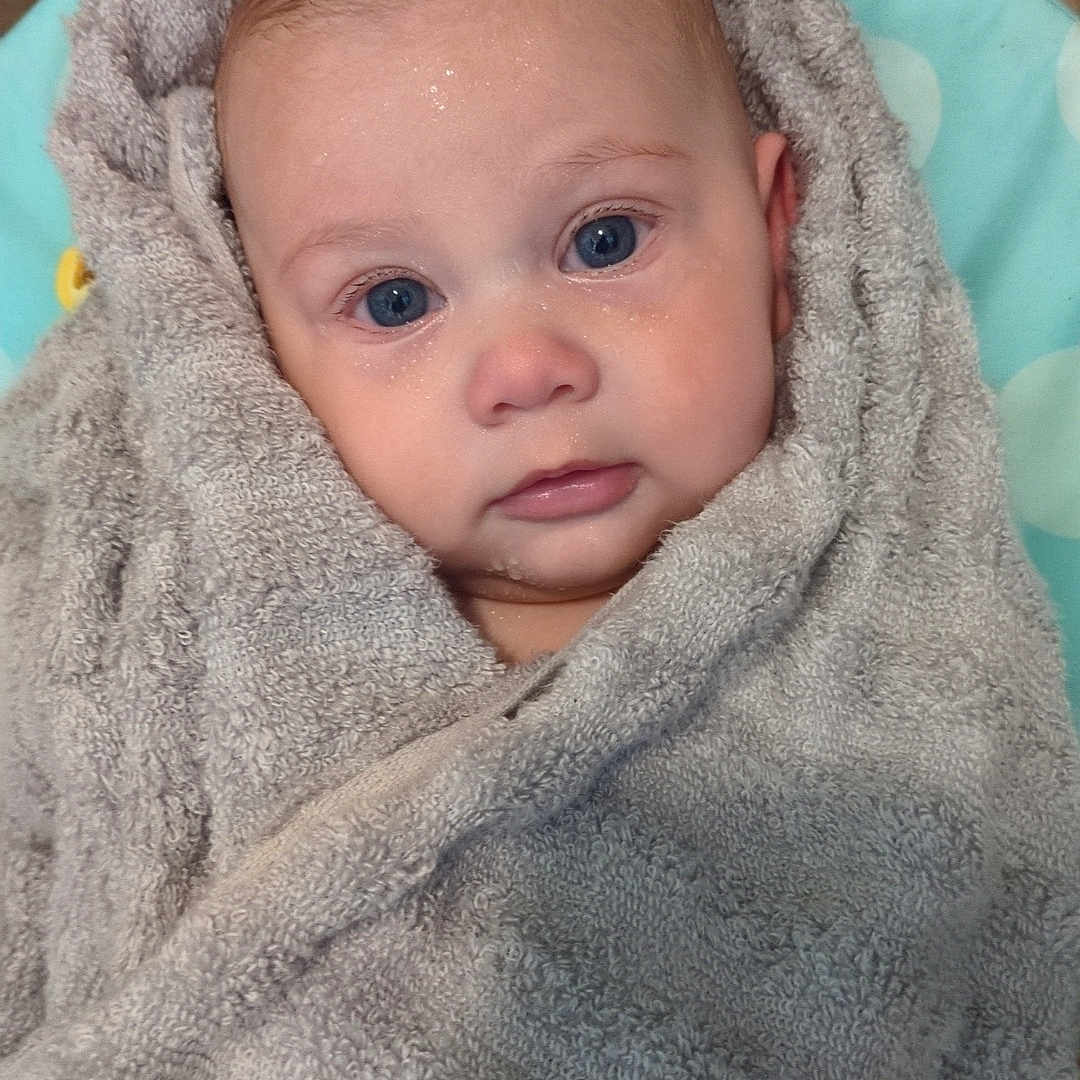 Alayia May-Belle joined the competition — help win amazing prizes! adorable, baby, blue_eyes, child, close_up, cute, expression, face, fresh, head, indoor, infant, looking, newborn, portrait, skin, soft_texture, towel, wet_skin, wrapped