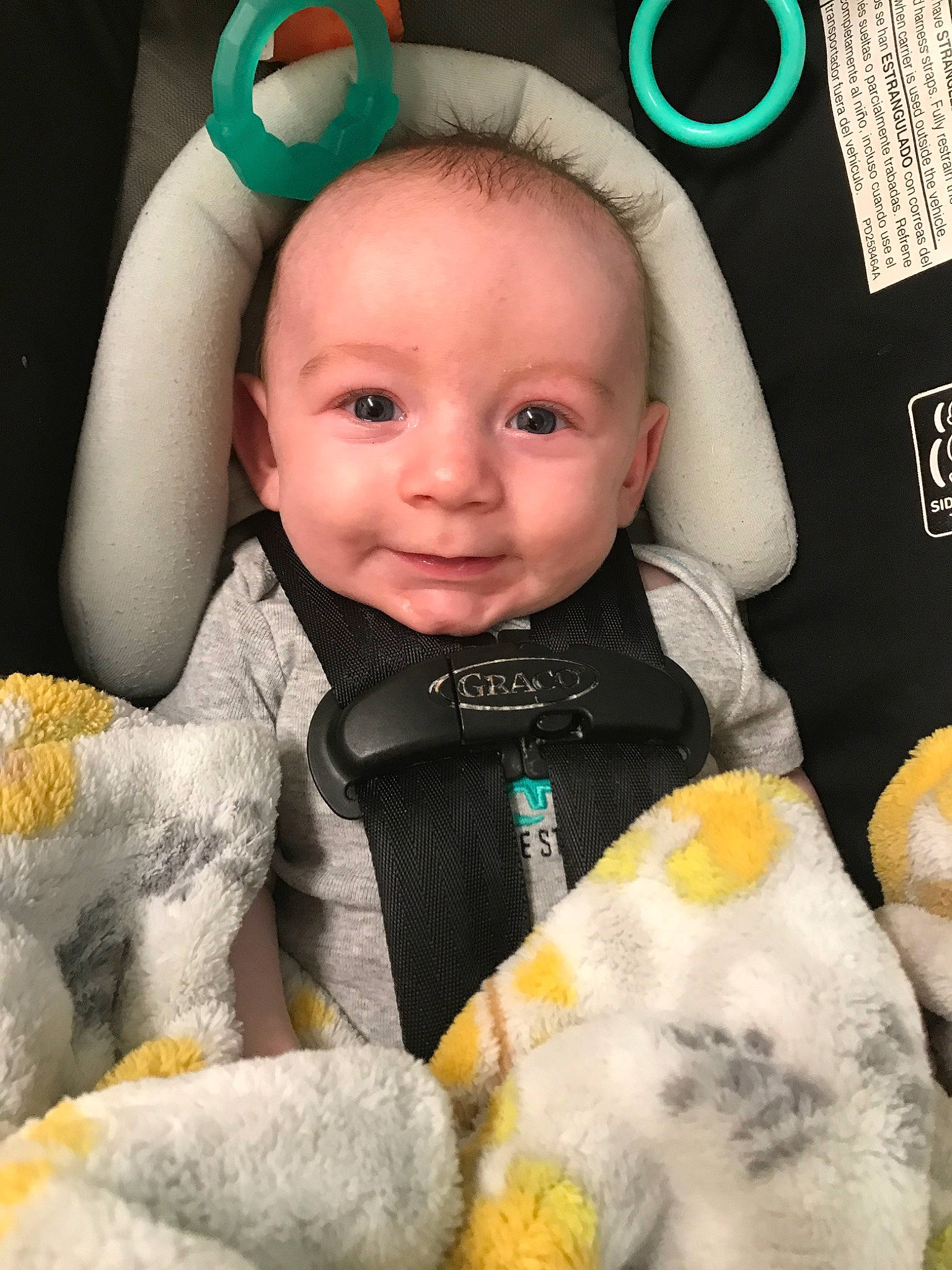 Blaine is registered to the contest to win money with this photo: baby, baby_in_car_seat, child, head, person, toddler