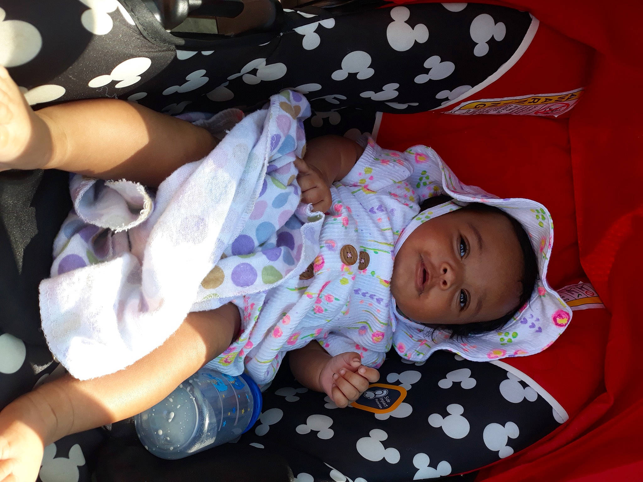 Tiana is registered to the contest to win money with this photo: baby, baby_products, baby_sleeping, baby_toddler_clothing, carmine, cheek, child, comfort, finger, gesture, human_body, lap, mouth, pattern, person, product, sleeve, textile, thigh, toddler