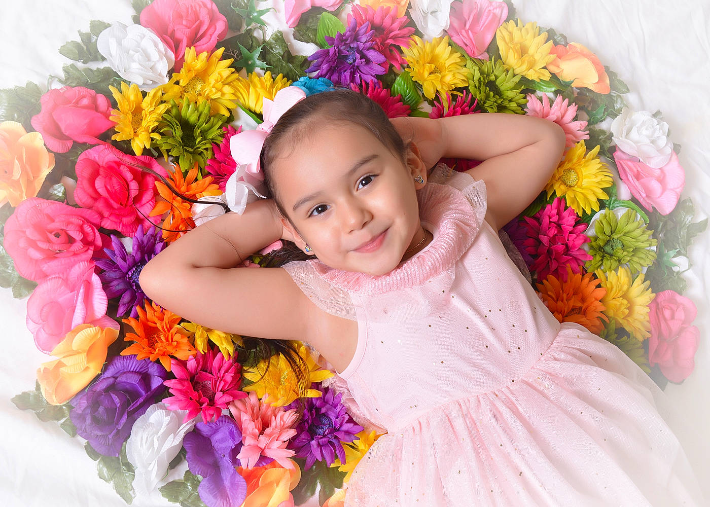 Jayli is registered to the contest to win money with this photo: baby_toddler_clothing, dress, facial_expression, fashion, flash_photography, flower, flower_arranging, fun, happy, headgear, headpiece, iris, joy, magenta, person, petal, pink, plant, smile, textile