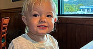 Beau joined the competition — help win amazing prizes! toddler, child, smiling, portrait, indoor, restaurant, table, checkered_tablecloth, window, mountains, scenic_view, blond_hair, blue_eyes, nike_shirt, wood_paneling, chair, framed_pictures, daylight, happy, candid