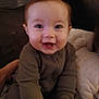 Dorothy is registered to the contest to win money with this photo: baby, babylaughing, bodypart, clothing, couch, cushion, face, furniture, happy, head, homedecor, laughing, mouth, newborn, person, photography, portrait, sitting, smile, teeth