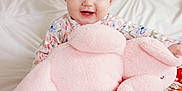 Dorothy is registered to the contest to win money with this photo: baby, bed, bedroom, blanket, couch, cushion, face, furniture, happy, head, homedecor, indoors, laughing, person, photography, portrait, room, smile, teddybear, toy