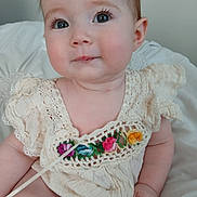 Dorothy is registered to the contest to win money with this photo: baby, bodypart, clothing, couch, cushion, diaper, dress, face, finger, flower, furniture, hand, head, homedecor, newborn, person, photography, plant, portrait, sitting