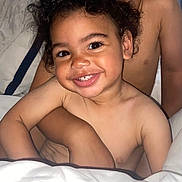 Easton joined the competition — help win amazing prizes! bare_chest, bed, blanket, child, closeup, comfort, cuddle, curly_hair, expression, face, family, happy, hug, indoors, person, sibling, skin, smile, toddler, young_child