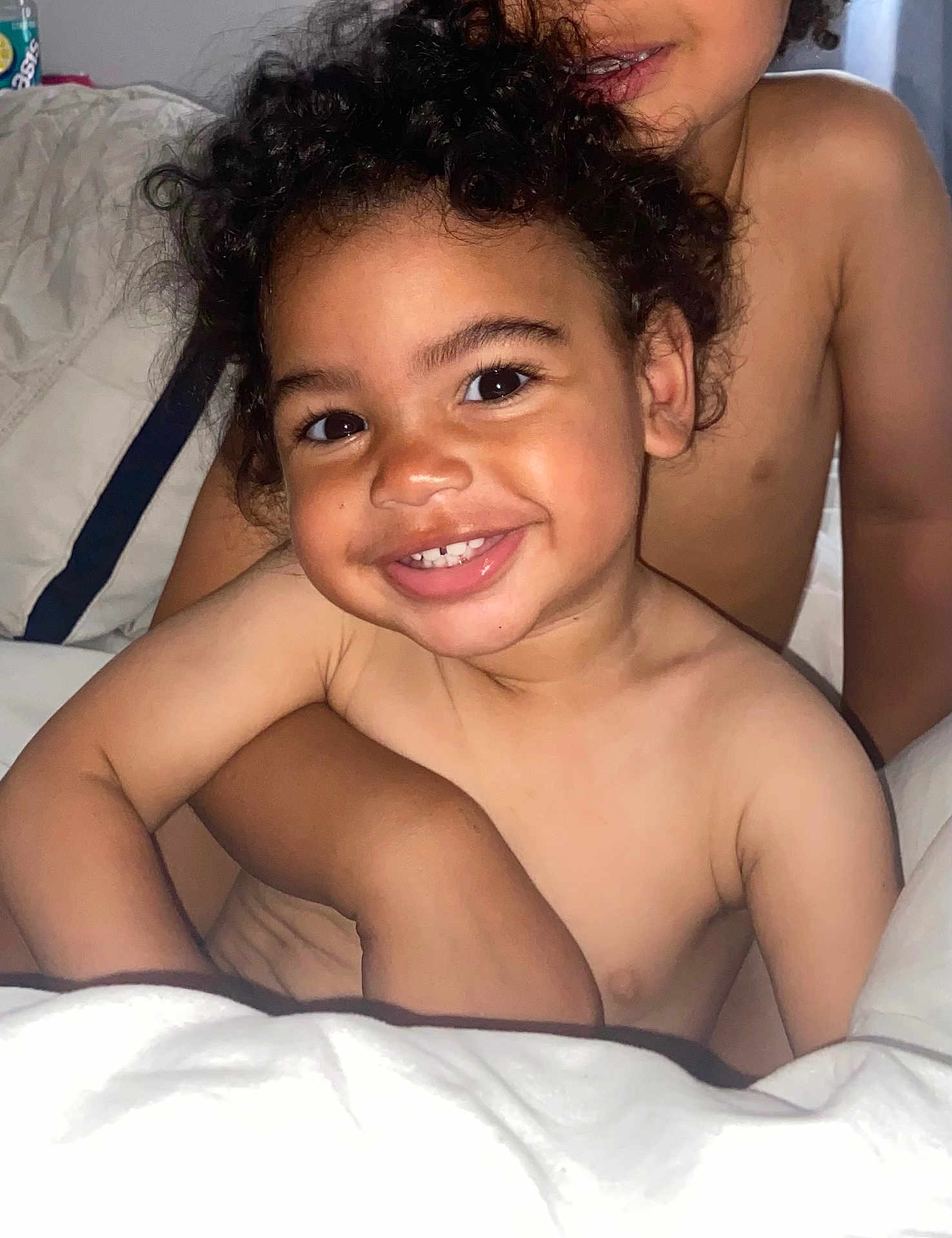 Easton joined the competition — help win amazing prizes! bare_chest, bed, blanket, child, closeup, comfort, cuddle, curly_hair, expression, face, family, happy, hug, indoors, person, sibling, skin, smile, toddler, young_child