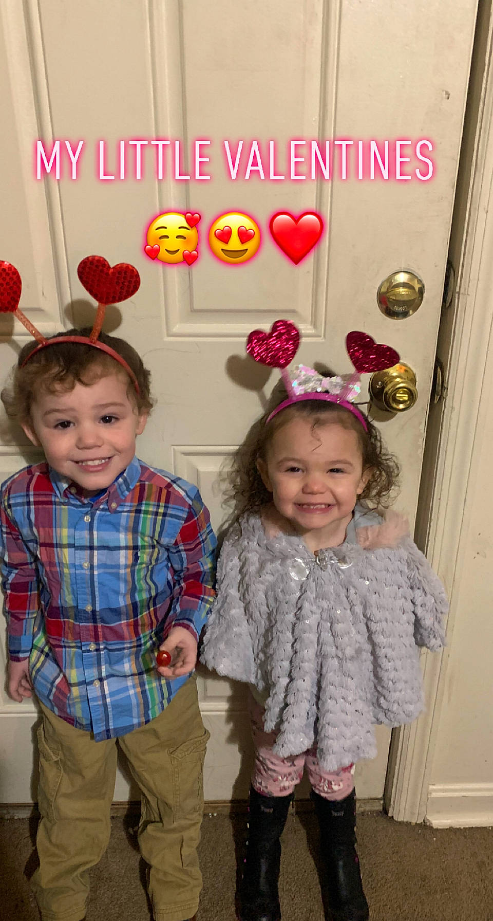 Norah is registered to the contest to win money with this photo: baby_toddler_clothing, child, clothing, design, event, face, facial_expression, fun, happy, holiday, joy, party_supply, pattern, person, plaid, room, sleeve, smile, snapshot, sock