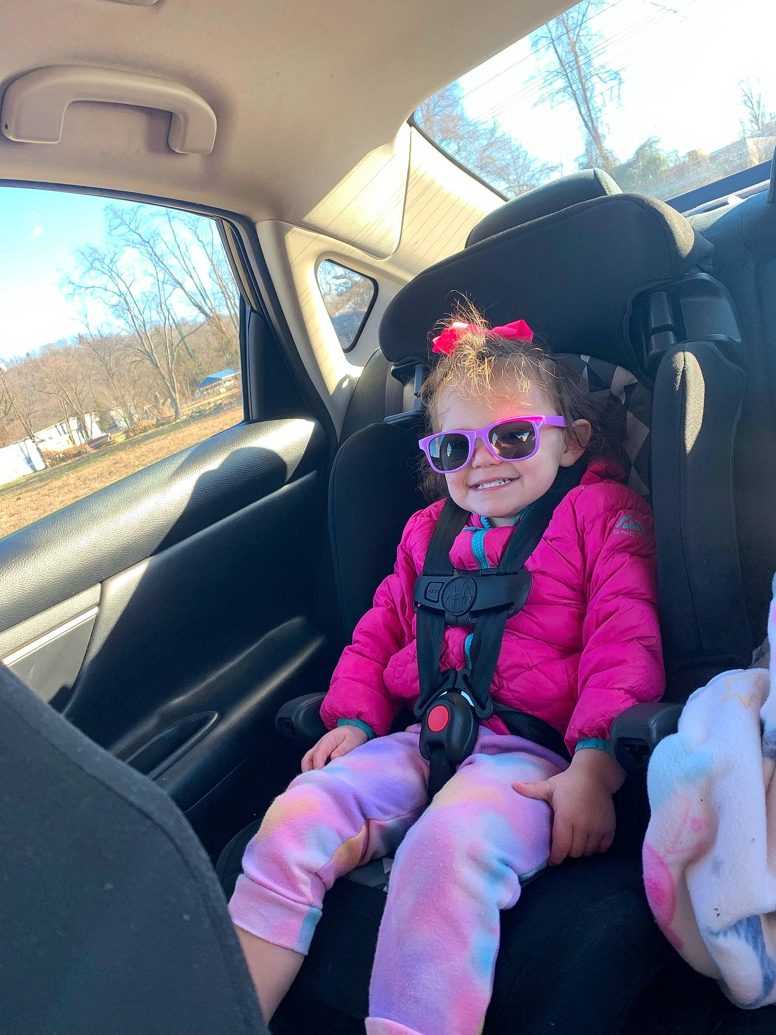 Norah joined the competition — help win amazing prizes! auto_part, automotive_design, automotive_exterior, car, car_seat, car_seat_cover, eyewear, goggles, head_restraint, joy, leisure, mode_of_transport, motor_vehicle, person, sky, smile, steering_part, steering_wheel, sunglasses, vehicle