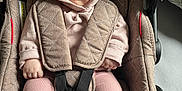 Aimée participe au concours pour gagner de l'argent avec cette photo : baby, car_seat, car_seat_harness, child, cushion, cute, footwear, head_covering, hood, indoor, infant, looking_away, pink_clothing, quilted, seated, small_hands, socks, soft_light, straps, warm_clothing