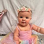 Aria is registered to the contest to win money with this photo: baby, child, tutu, pink_dress, flower_crown, headband, fairy, sparkles, pastel_colors, sitting, curious, cute, infant, portrait, celebration, decor, bunting, soft_light, indoor, adorable