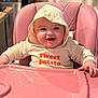 baby, infant, child, smiling, hoodie, pink_high_chair, high_chair, indoor, kitchen, happy, cute, face, person, clothing, sitting, table, food_tray, young_child, expression, playful