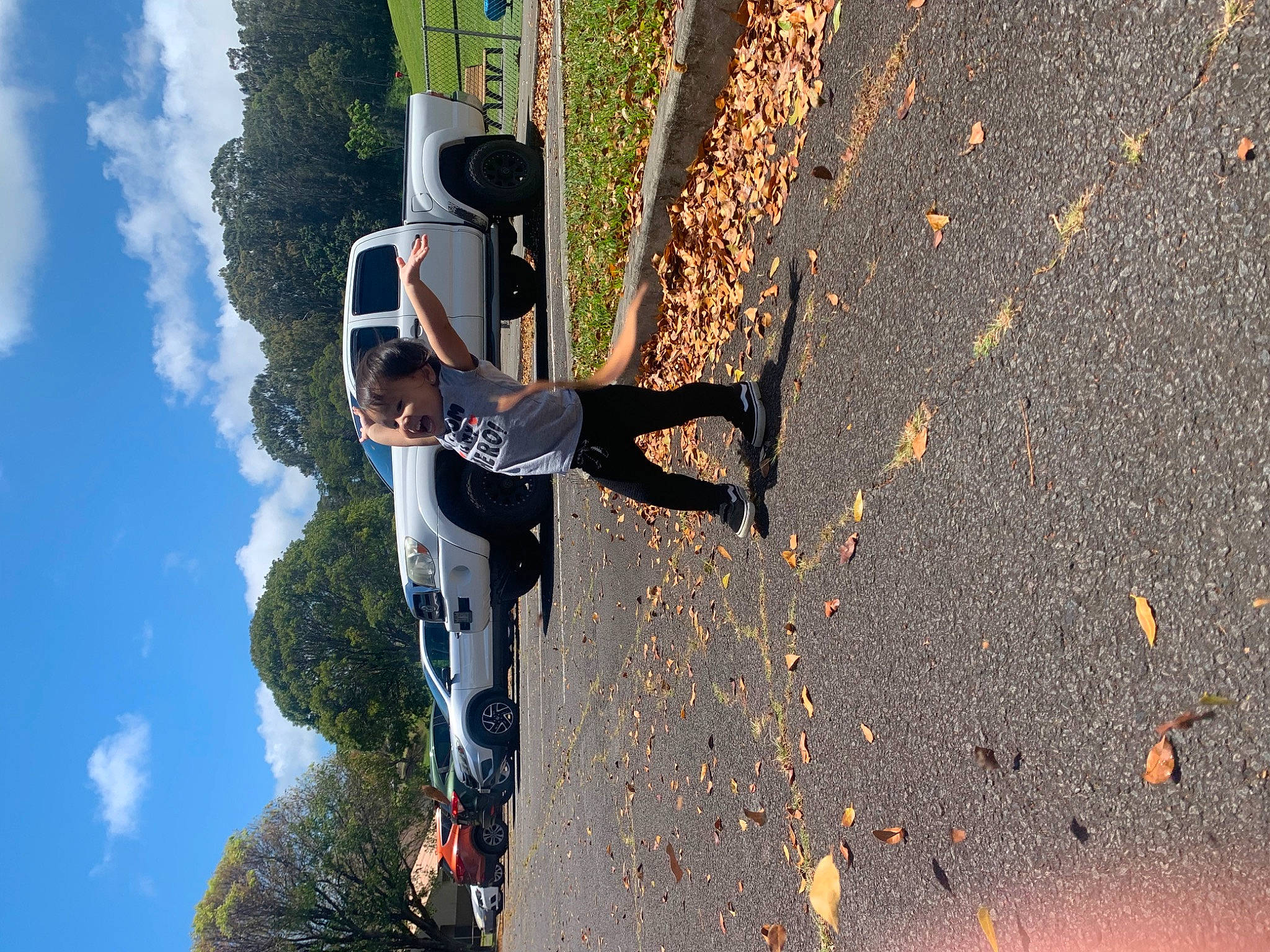 Bailey is registered to the contest to win money with this photo: asphalt, automotive_design, automotive_exterior, automotive_lighting, automotive_tire, automotive_wheel_system, car, cloud, fun, motor_vehicle, person, road, road_surface, sky, tar, tints_and_shades, tire, tree, vehicle, vehicle_door