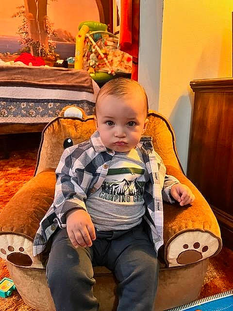 Azriel joined the competition — help win amazing prizes! baby, baby_toddler_clothing, chair, cheek, child, comfort, flooring, fun, happy, lap, leg, leisure, orange, person, room, sitting, sneakers, thigh, toddler, vacation