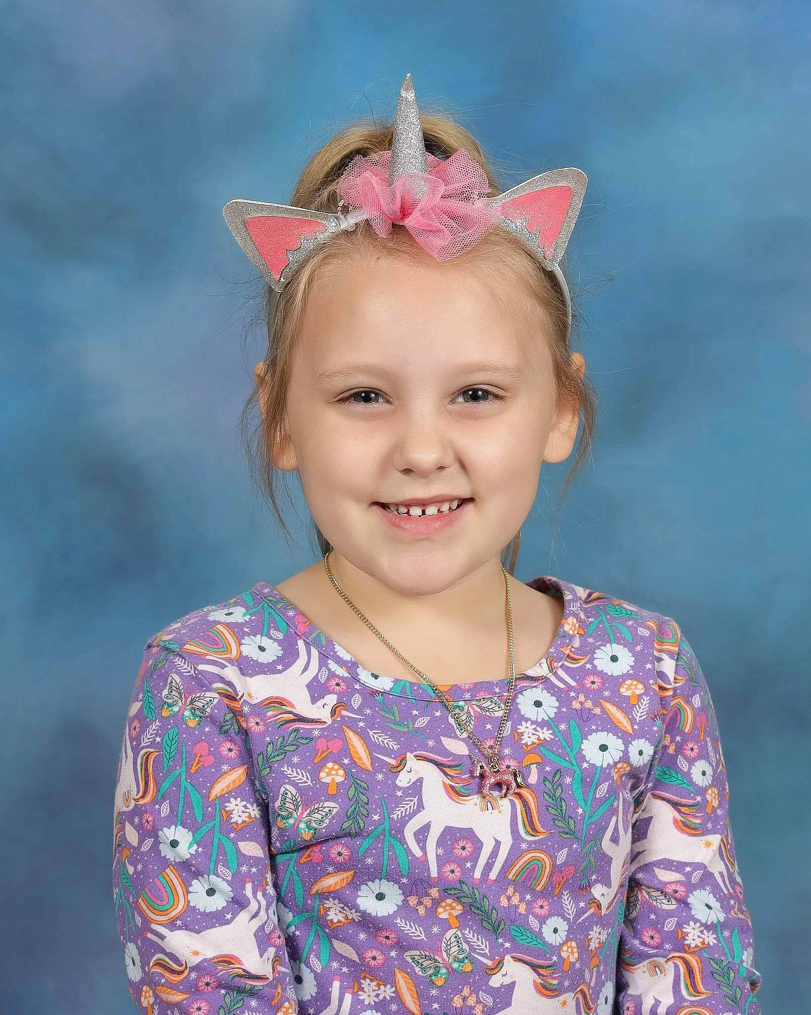 Emily is registered to the contest to win money with this photo: beauty, blond, ear, electric_blue, eye, eyelash, face, fun, hair_tie, happy, headband, headpiece, iris, joy, magenta, neck, pattern, person, pink, skin