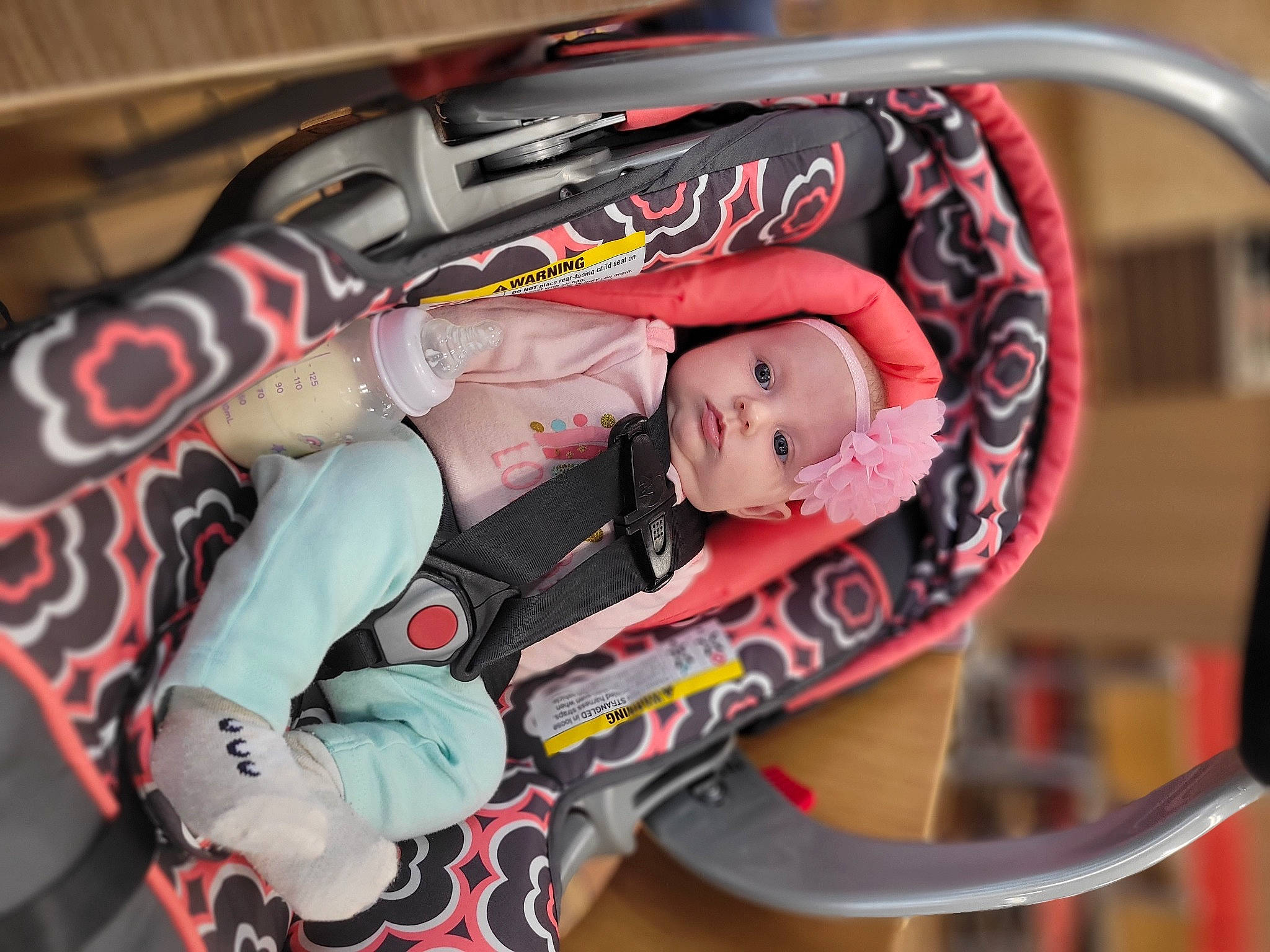 Hailey is registered to the contest to win money with this photo: auto_part, automotive_design, automotive_exterior, baby, baby_carriage, baby_products, bag, car_seat, carmine, child, fashion_accessory, headwear, helmet, motor_vehicle, pattern, person, personal_protective_equipment, recreation, tire, toddler