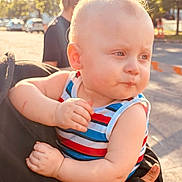 Jr joined the competition — help win amazing prizes! baby, child, outdoor, sunlight, striped_clothing, holding, person, blond_hair, daylight, street, thoughtful, toddler, face, portrait, cute, young_child, summer, sleeveless_shirt, hand, expression