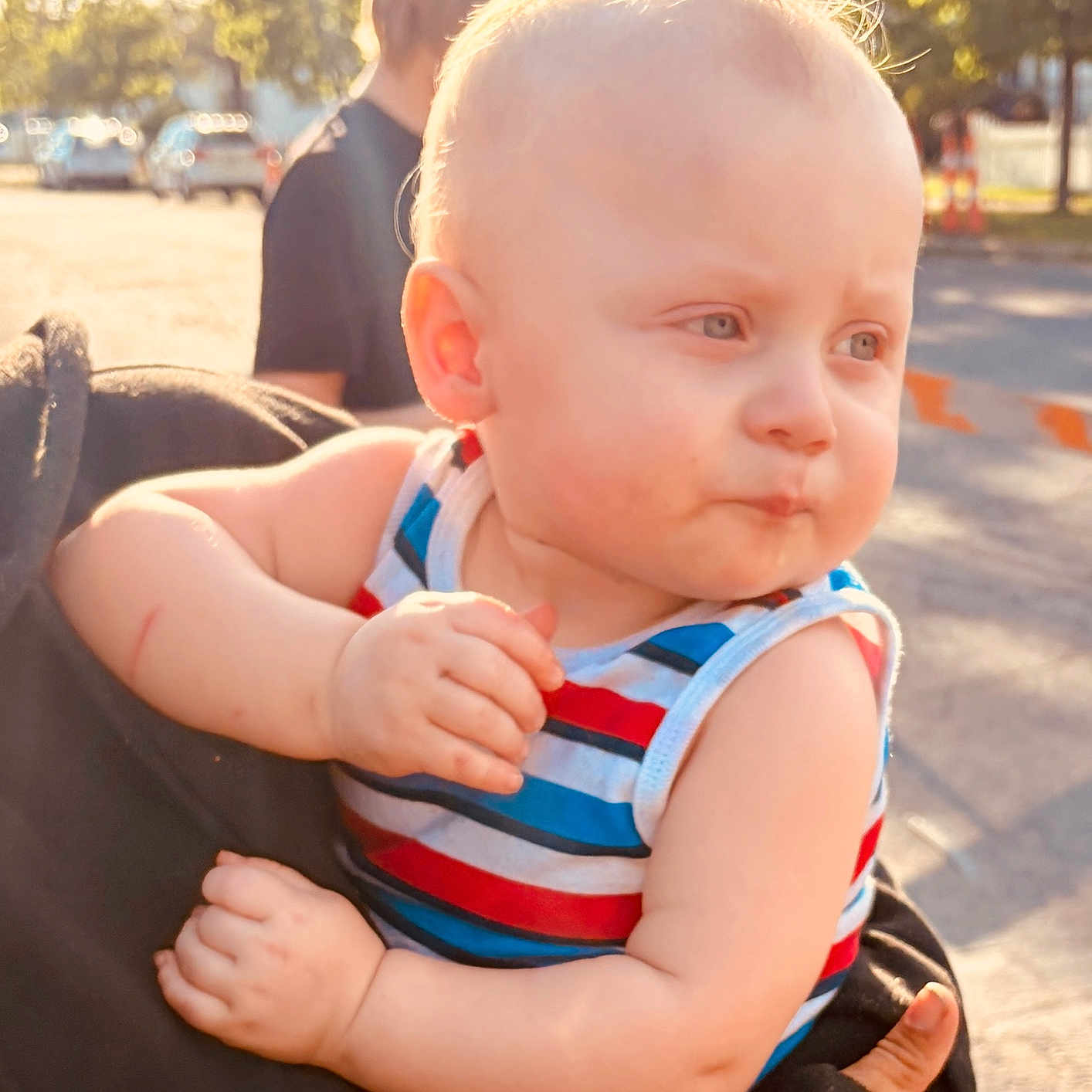 Jr joined the competition — help win amazing prizes! baby, child, outdoor, sunlight, striped_clothing, holding, person, blond_hair, daylight, street, thoughtful, toddler, face, portrait, cute, young_child, summer, sleeveless_shirt, hand, expression
