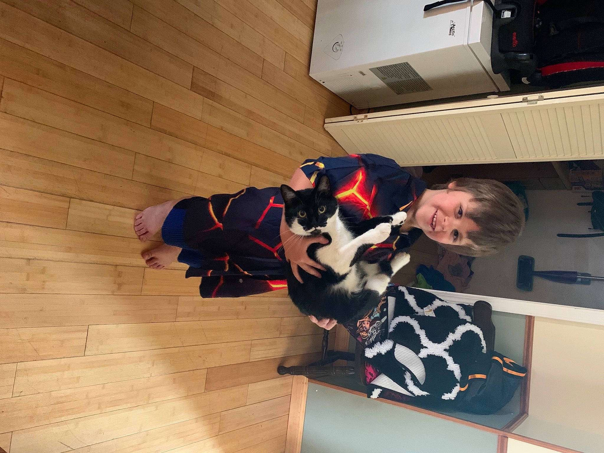 Gabriel joined the competition — help win amazing prizes! audio_equipment, carnivore, comfort, companion_dog, dog, dog_breed, eyewear, flooring, fun, fur, hardwood, home_appliance, joy, peripheral, person, room, sitting, smile, sporting_group, t_shirt