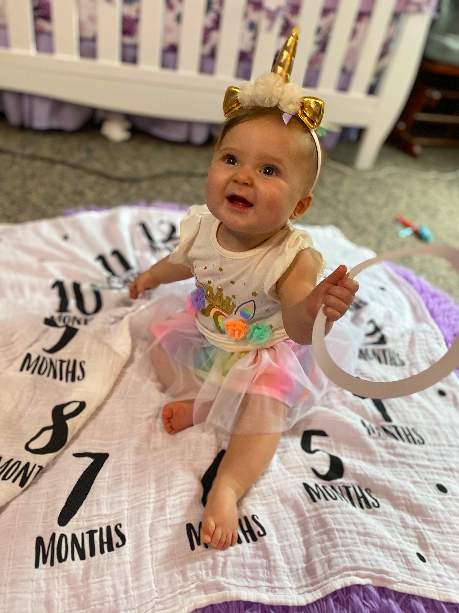 Veronica is registered to the contest to win money with this photo: baby, baby_toddler_clothing, child, crown, event, fashion_accessory, flooring, fun, hair_accessory, happy, headband, headpiece, jewellery, leisure, magenta, person, pink, sitting, smile, toddler